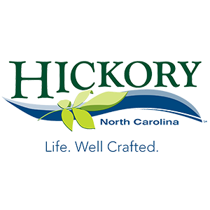 city of hickory blue text and green leaf