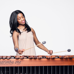 black femal playing marimba with mallets